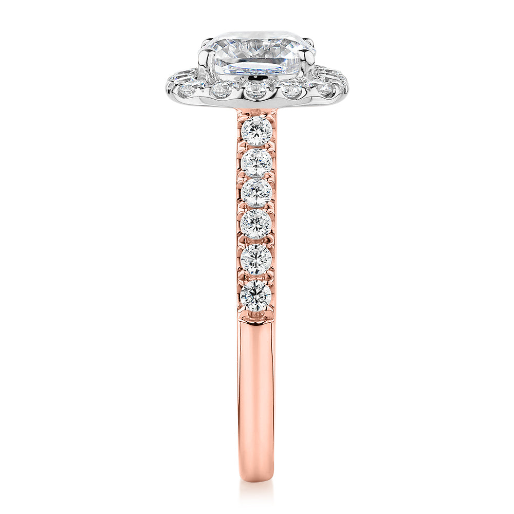 Cushion and Round Brilliant halo engagement ring with 1.65 carats* of diamond simulants in 14 carat rose and white gold