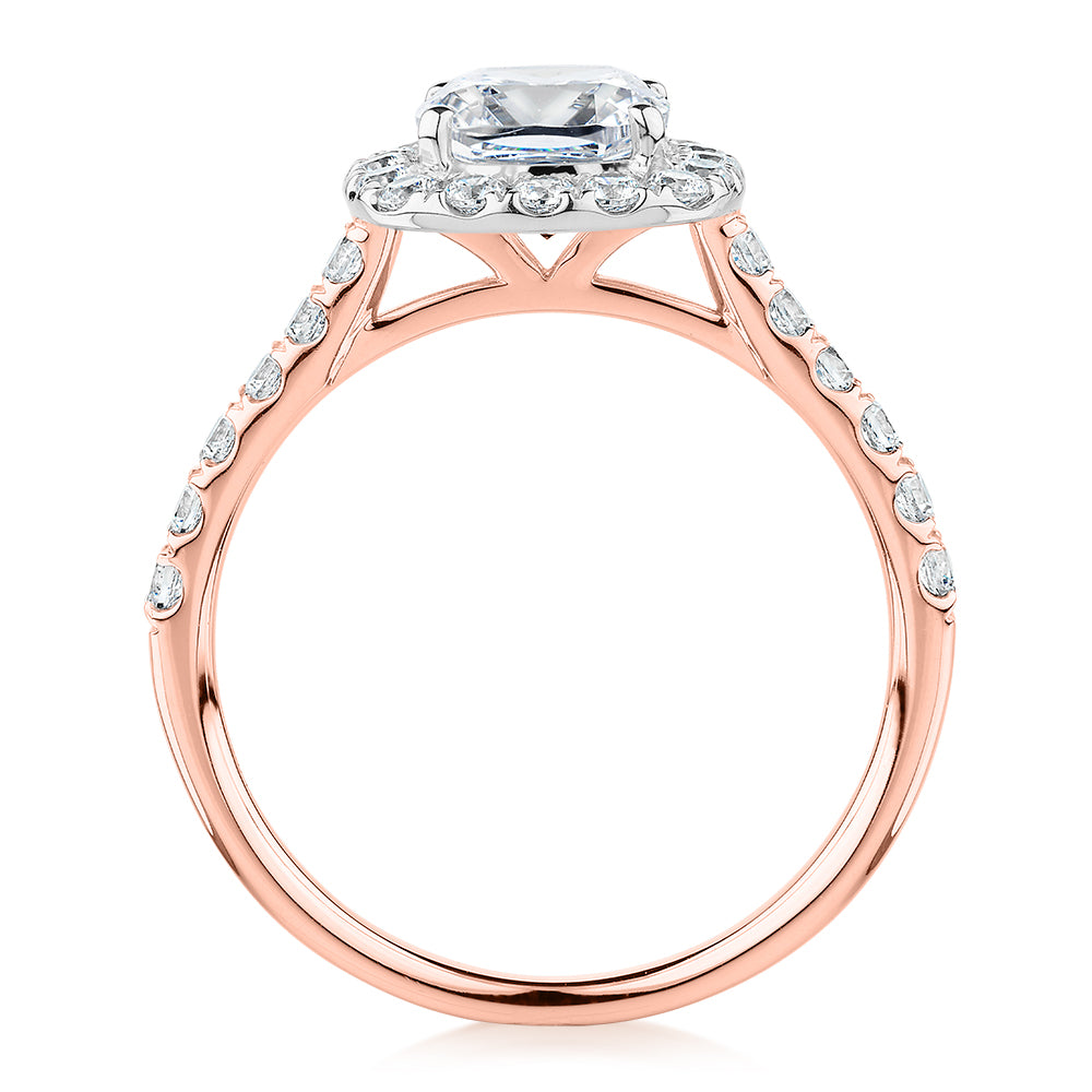 Cushion and Round Brilliant halo engagement ring with 1.65 carats* of diamond simulants in 14 carat rose and white gold