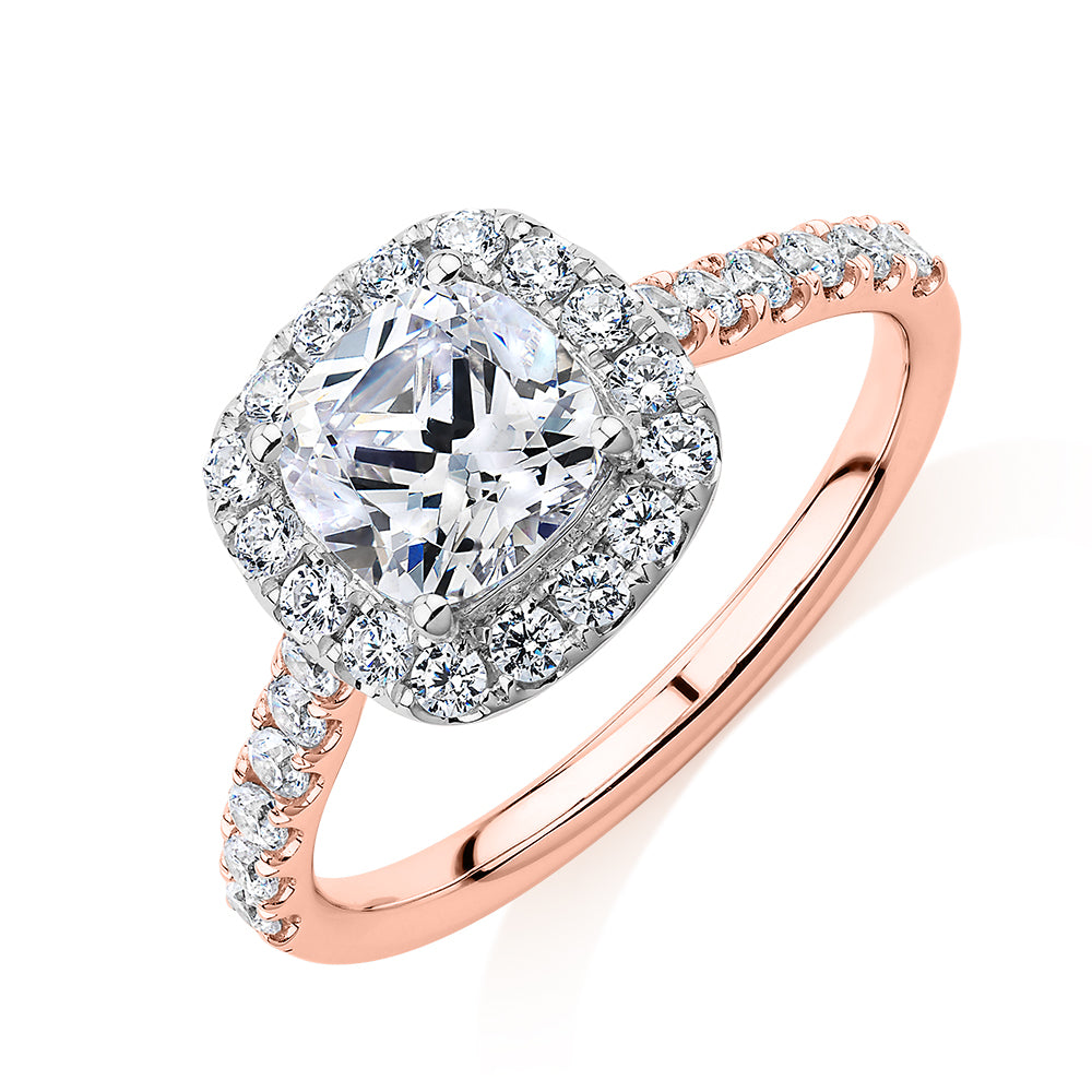 Cushion and Round Brilliant halo engagement ring with 1.65 carats* of diamond simulants in 14 carat rose and white gold