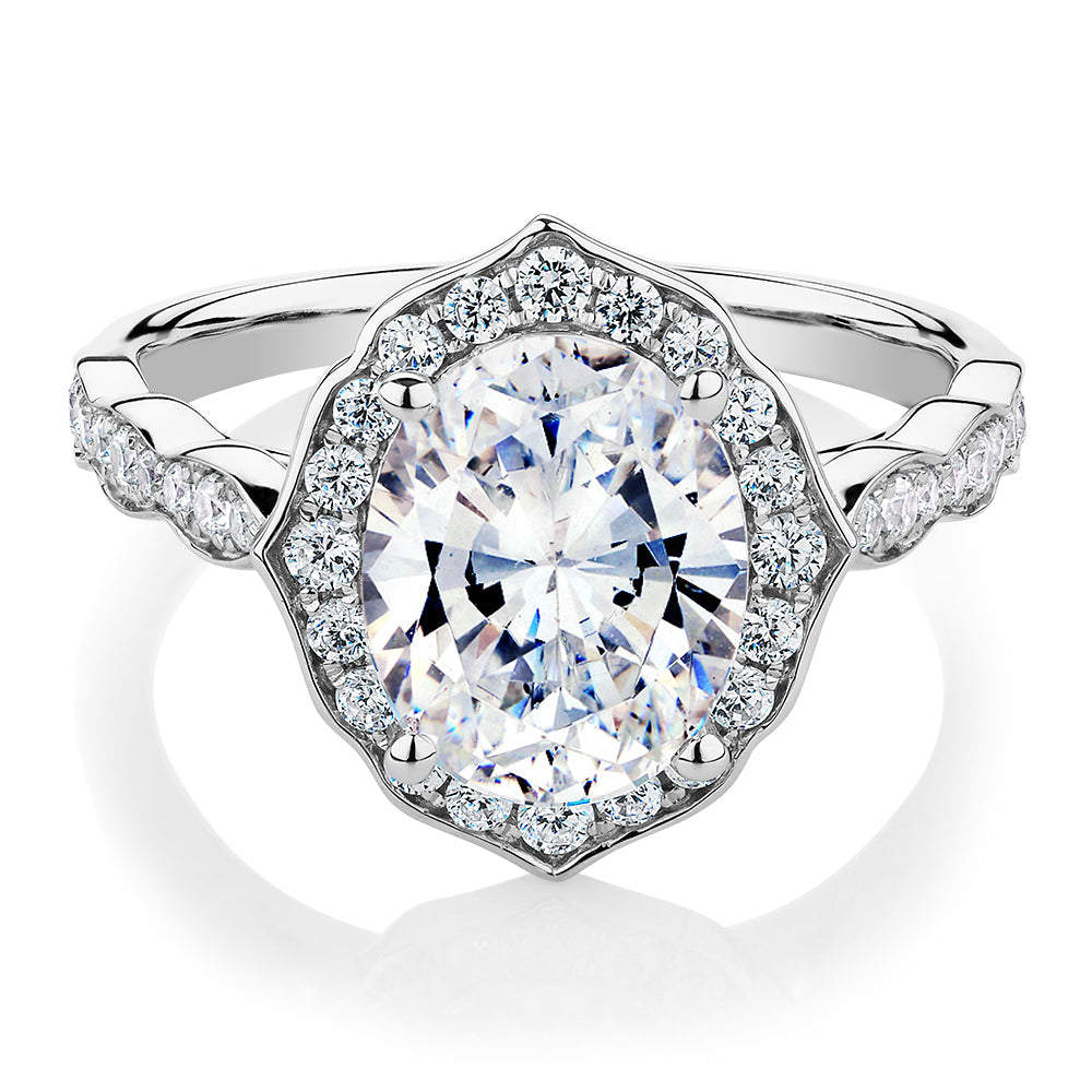 Oval and Round Brilliant halo engagement ring with 2.86 carats* of diamond simulants in 14 carat white gold