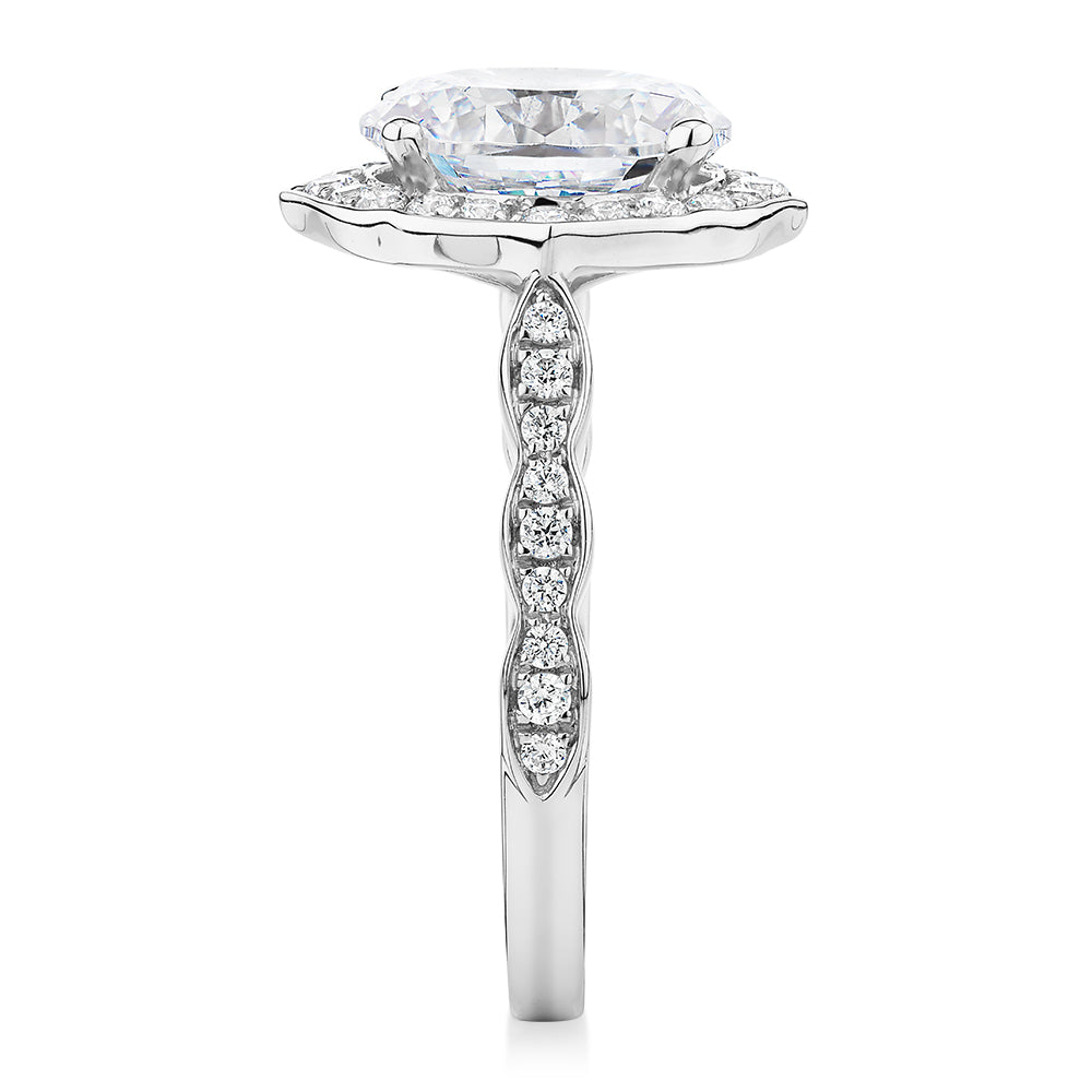 Oval and Round Brilliant halo engagement ring with 2.86 carats* of diamond simulants in 14 carat white gold