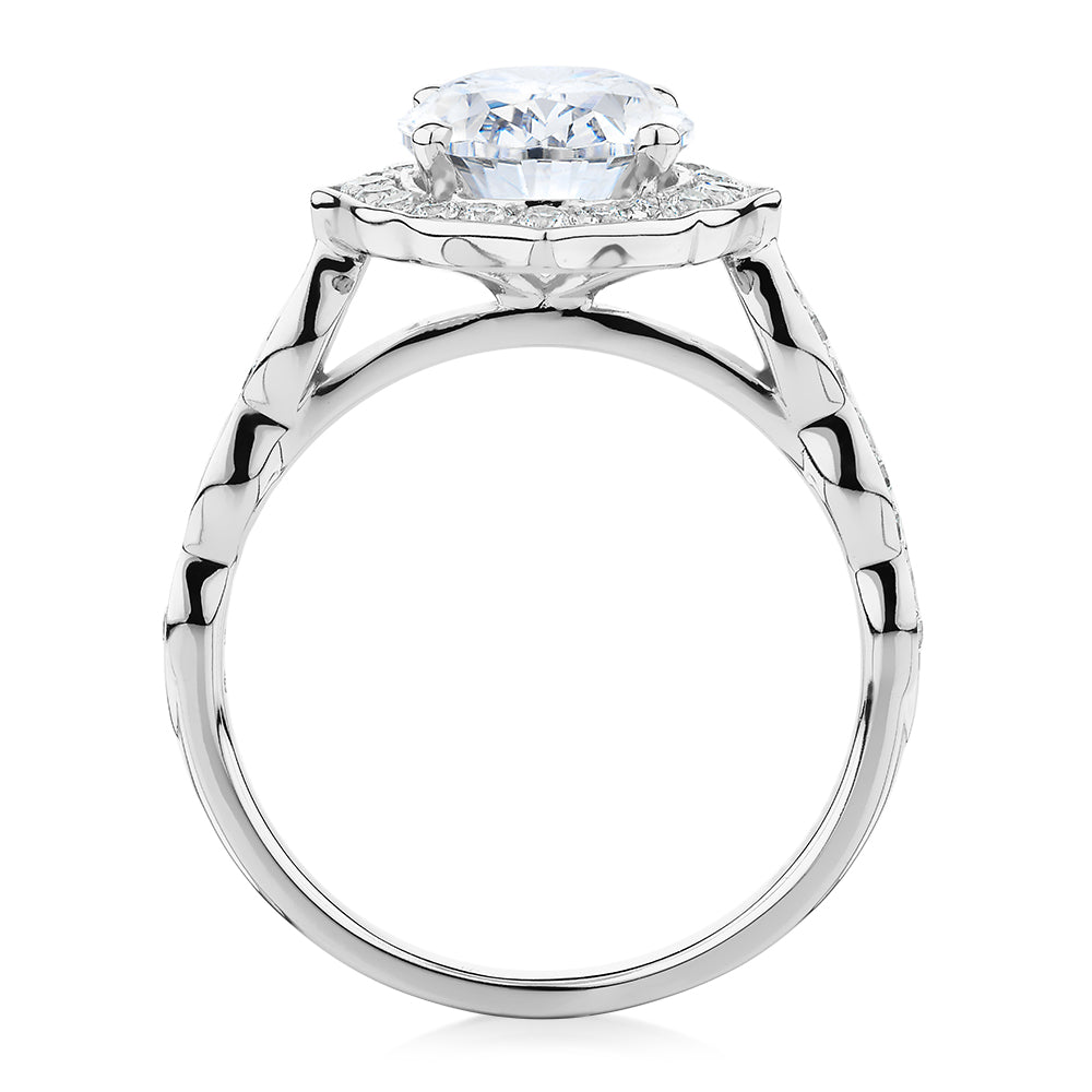 Oval and Round Brilliant halo engagement ring with 2.86 carats* of diamond simulants in 14 carat white gold
