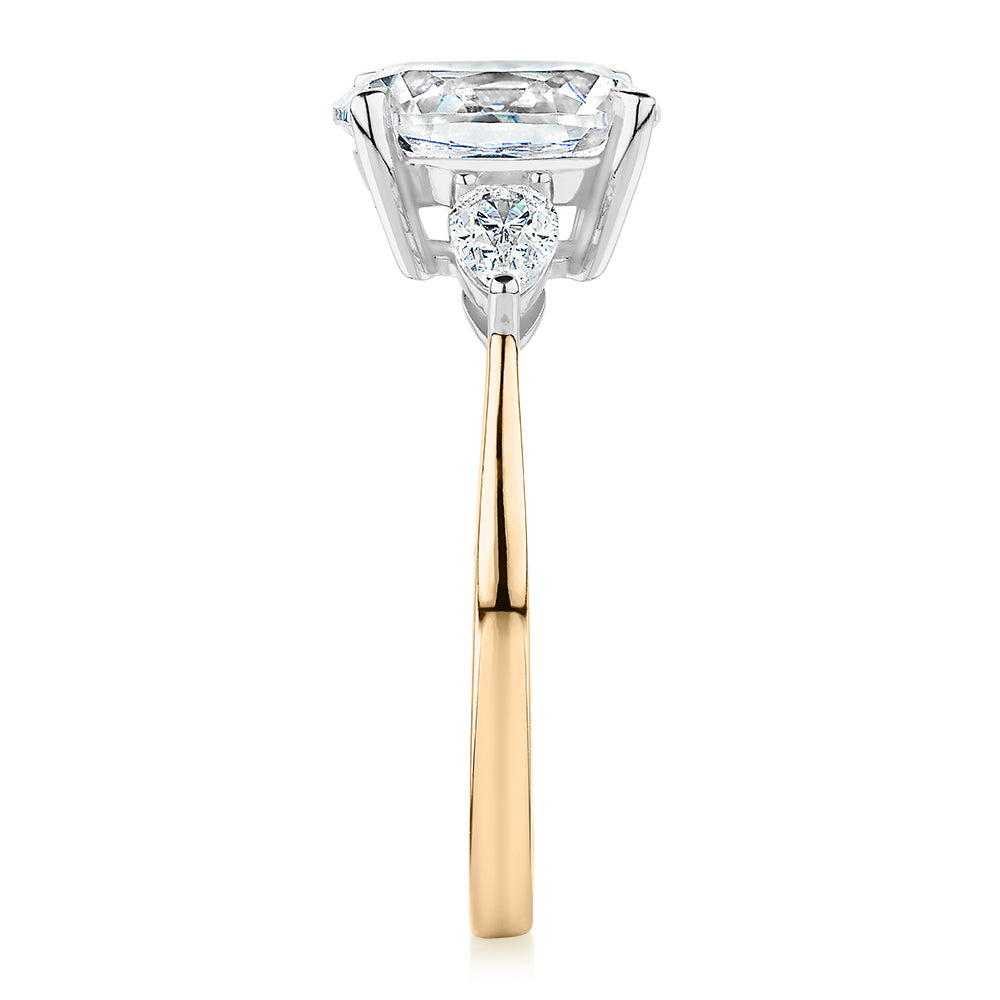 Oval and Pear shouldered engagement ring with 2.36 carats* of diamond simulants in 14 carat yellow and white gold