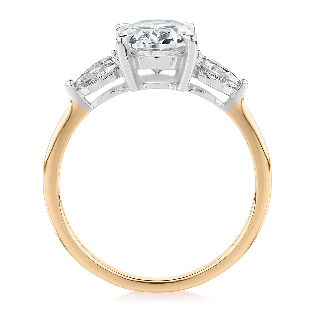 Oval and Pear shouldered engagement ring with 2.36 carats* of diamond simulants in 14 carat yellow and white gold