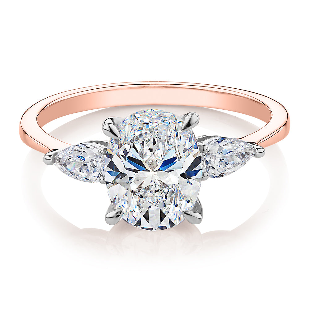 Oval and Pear shouldered engagement ring with 2.36 carats* of diamond simulants in 14 carat rose and white gold