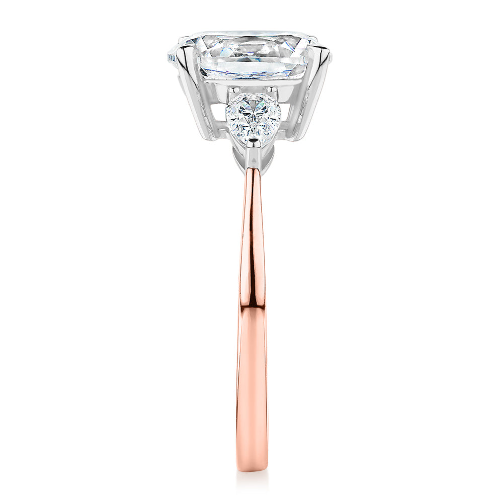 Oval and Pear shouldered engagement ring with 2.36 carats* of diamond simulants in 14 carat rose and white gold