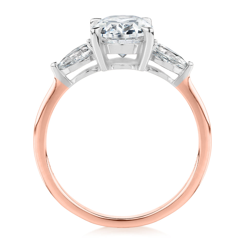 Oval and Pear shouldered engagement ring with 2.36 carats* of diamond simulants in 14 carat rose and white gold