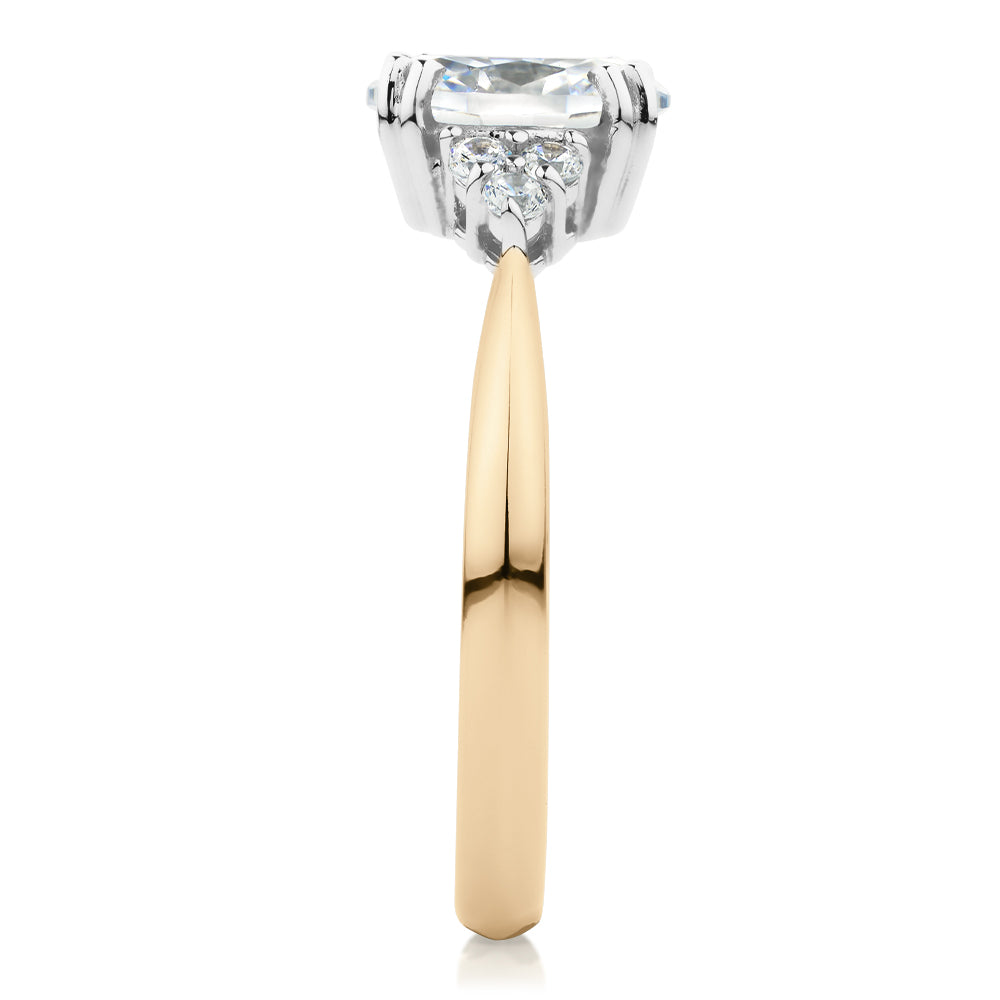 Oval and Round Brilliant shouldered engagement ring with 1.3 carats* of diamond simulants in 14 carat yellow and white gold