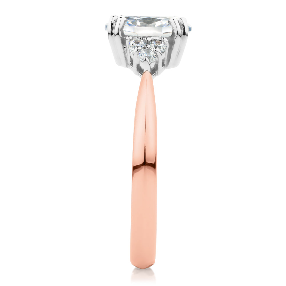 Oval and Round Brilliant shouldered engagement ring with 1.3 carats* of diamond simulants in 14 carat rose and white gold