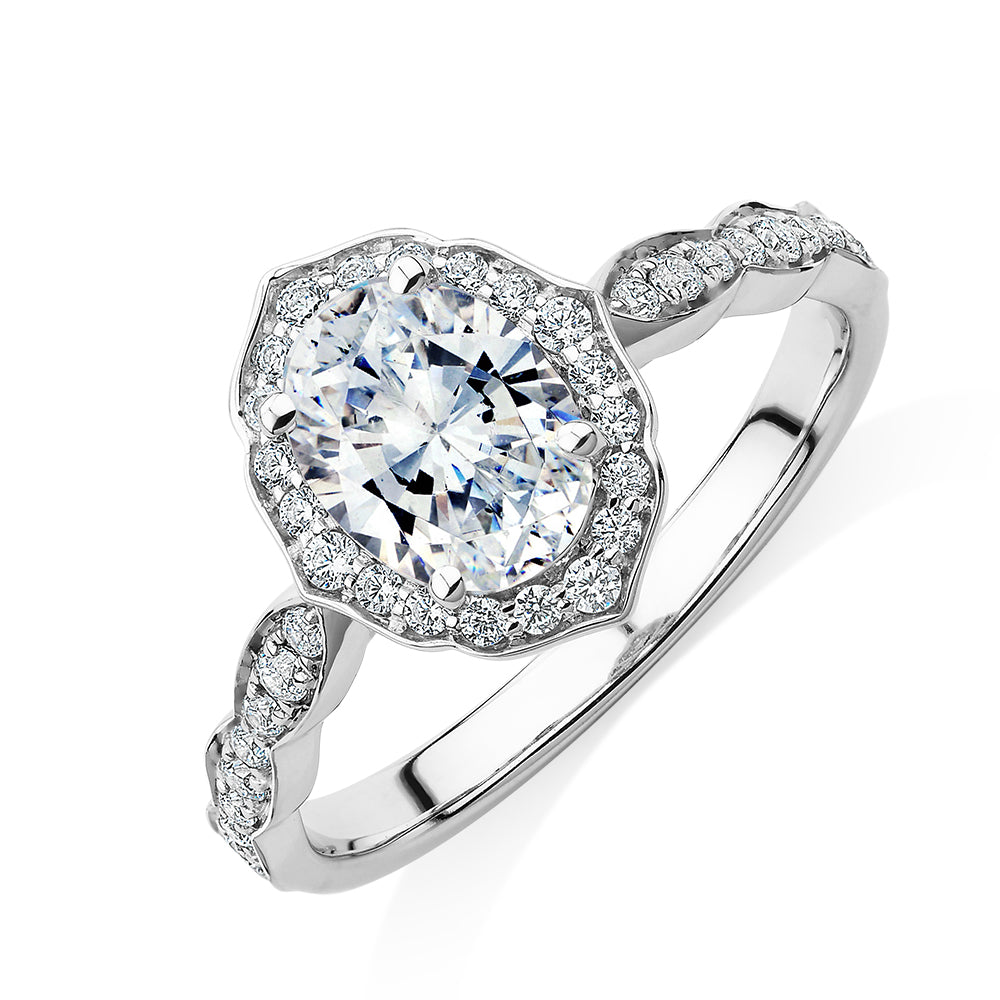 Oval halo engagement ring with 1.55 carats* of diamond simulants in 14 carat white gold