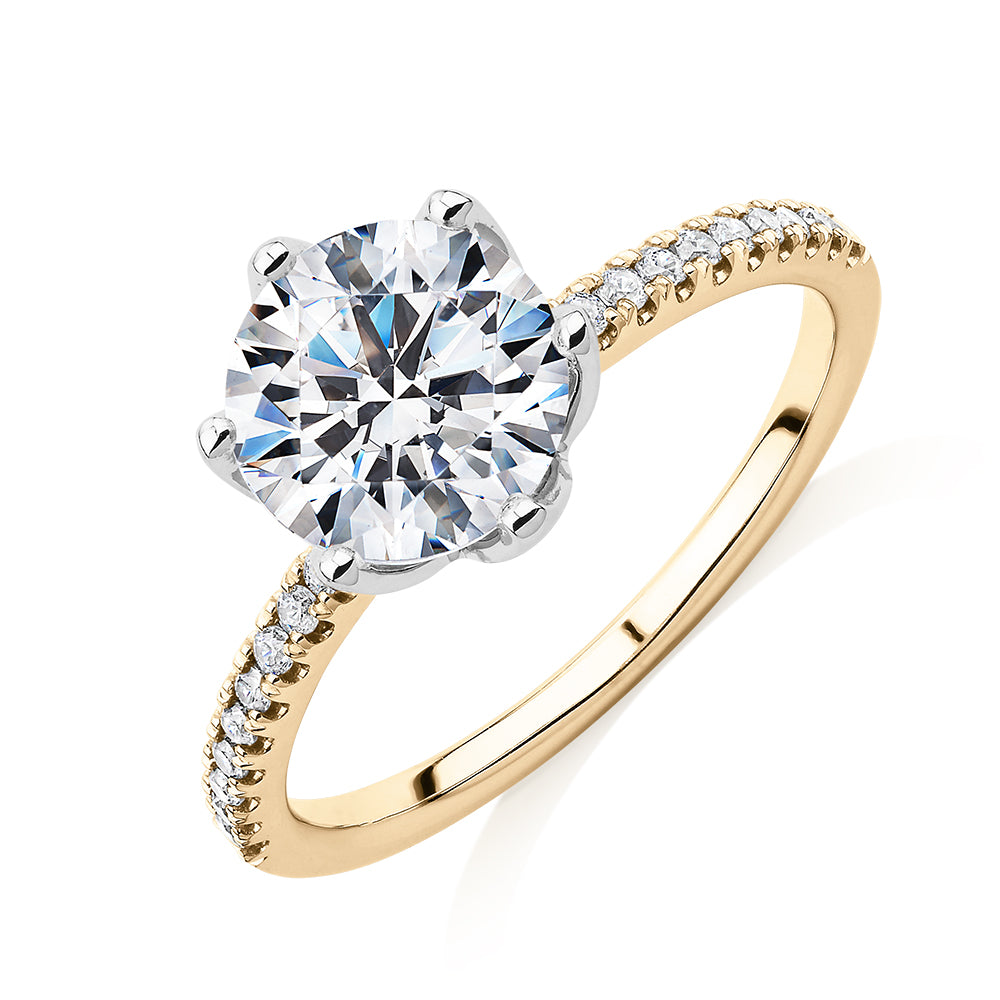 Round Brilliant shouldered engagement ring with 2.24 carats* of diamond simulants in 14 carat yellow and white gold