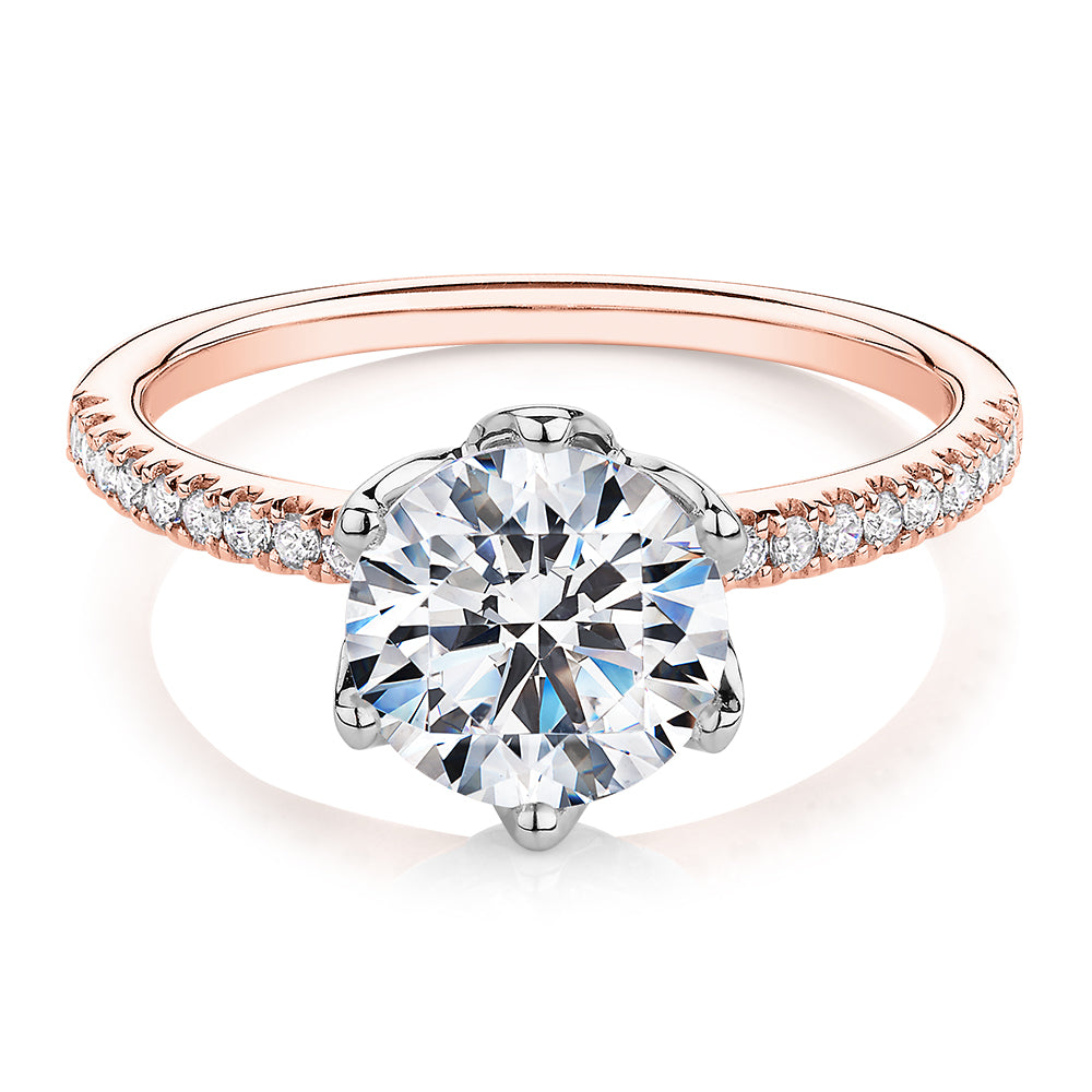 Round Brilliant shouldered engagement ring with 2.24 carats* of diamond simulants in 14 carat rose and white gold