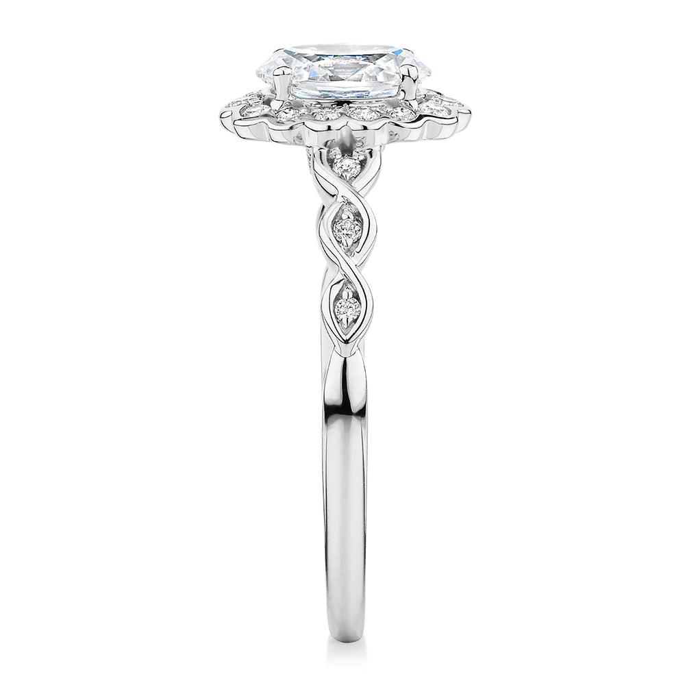 Oval and Round Brilliant halo engagement ring with 0.97 carats* of diamond simulants in 10 carat white gold