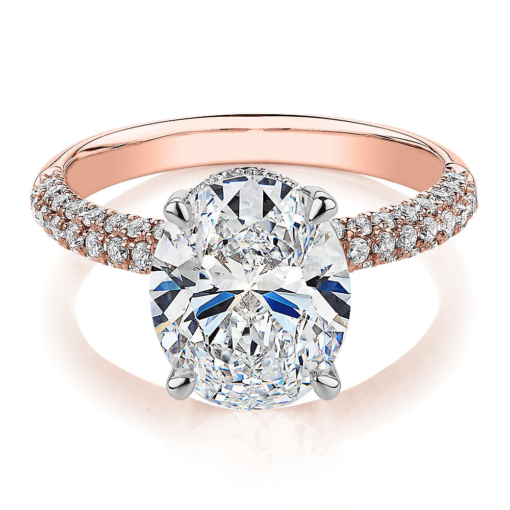 Oval and Round Brilliant shouldered engagement ring with 4.35 carats* of diamond simulants in 10 carat rose gold