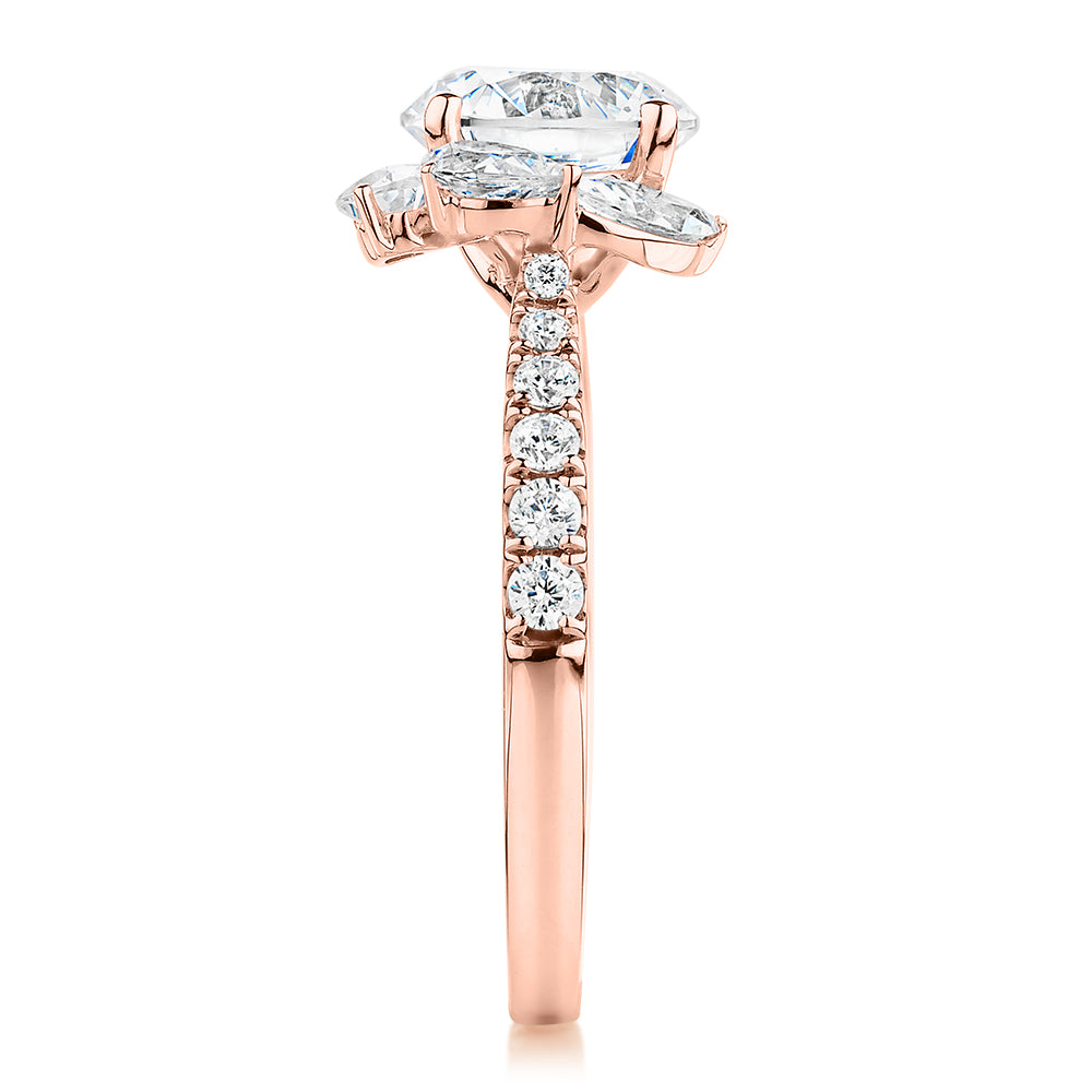 Round Brilliant and Marquise shouldered engagement ring with 2.78 carats* of diamond simulants in 14 carat rose gold