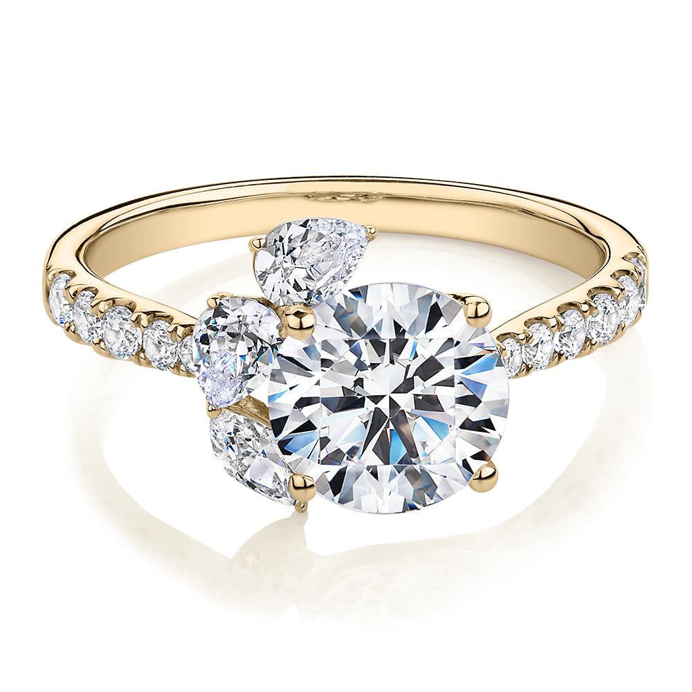 Round Brilliant and Marquise shouldered engagement ring with 2.78 carats* of diamond simulants in 14 carat yellow gold