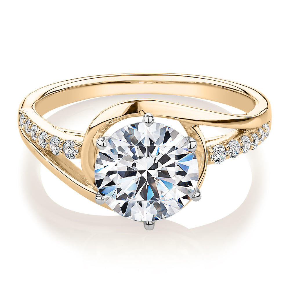 Round Brilliant shouldered engagement ring with 2.18 carats* of diamond simulants in 14 carat yellow and white gold