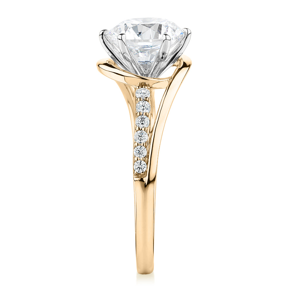 Round Brilliant shouldered engagement ring with 2.18 carats* of diamond simulants in 14 carat yellow and white gold