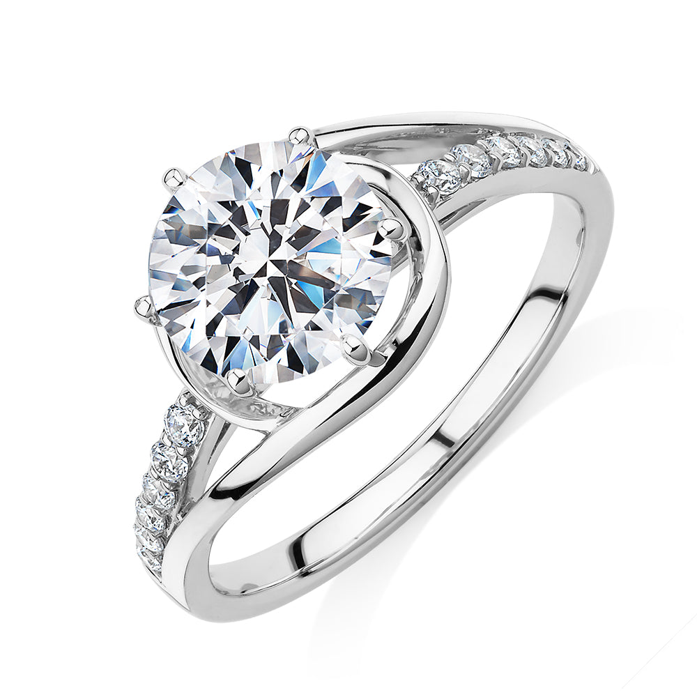 Round Brilliant shouldered engagement ring with 2.18 carats* of diamond simulants in 14 carat white gold
