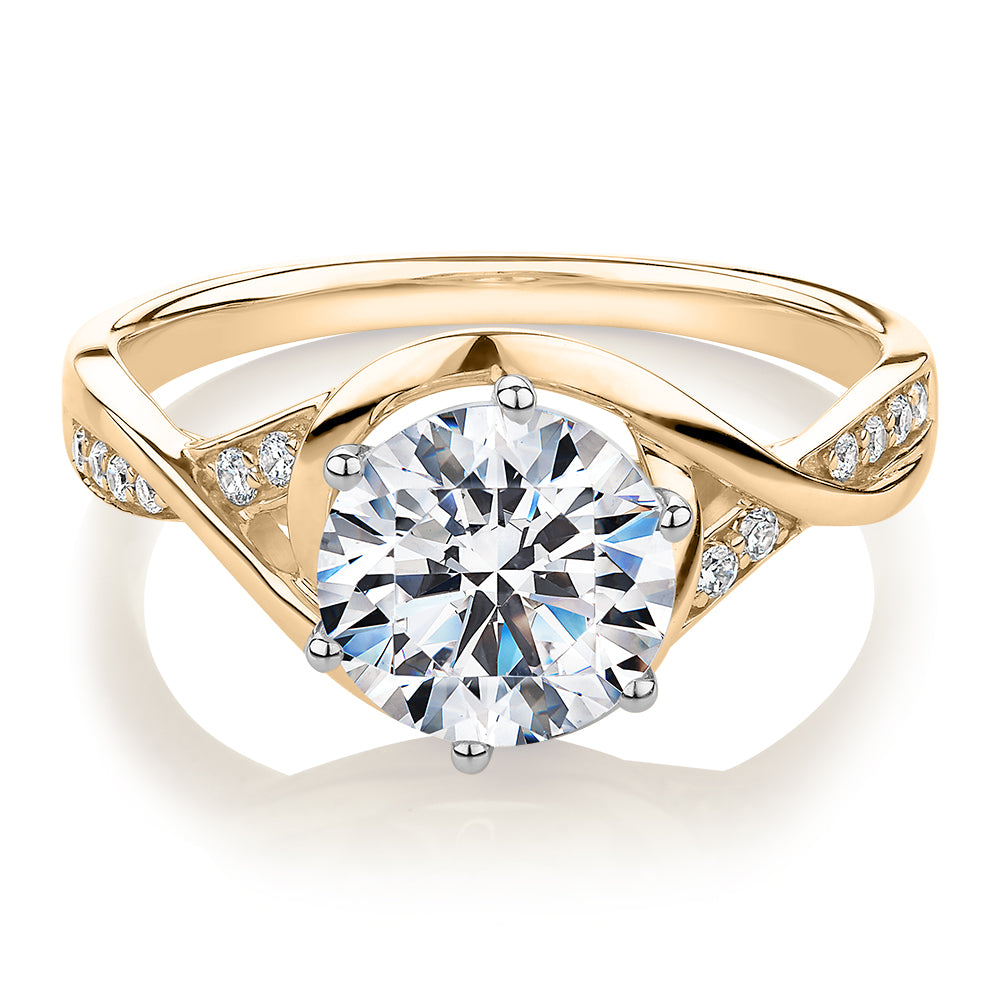 Round Brilliant shouldered engagement ring with carats* of diamond  simulants in 14 carat yellow and white gold