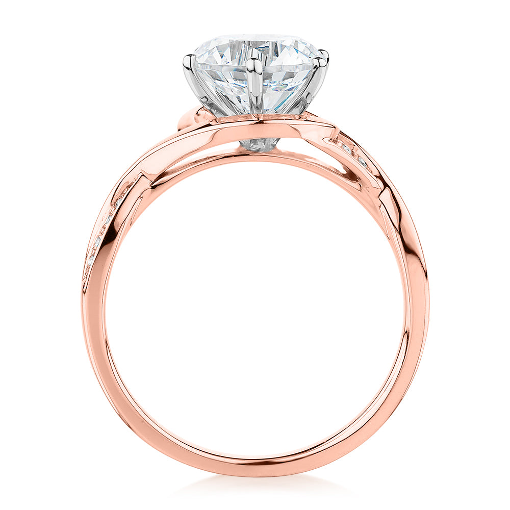 Round Brilliant shouldered engagement ring with 2.13 carats* of diamond simulants in 14 carat rose and white gold