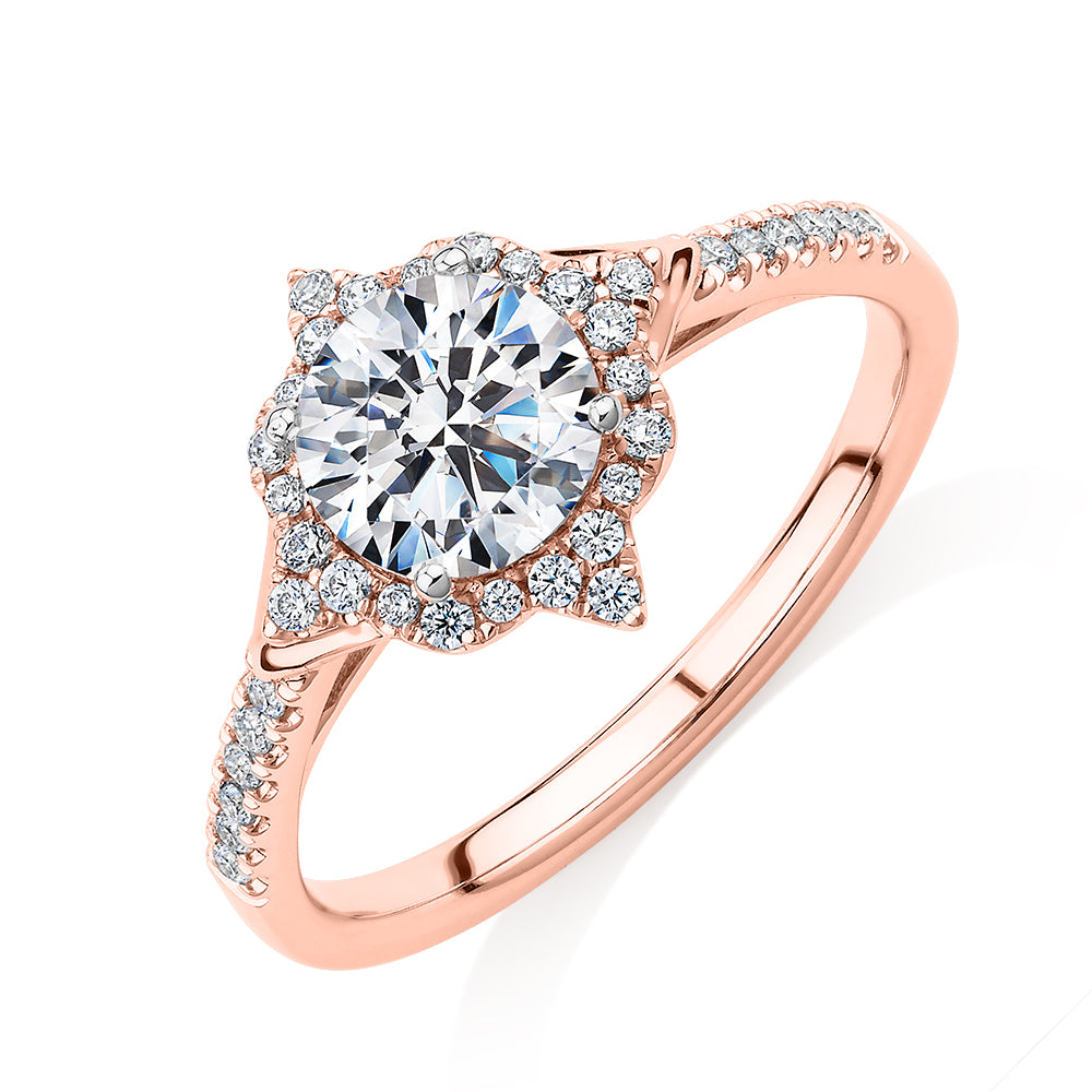 Round Brilliant halo engagement ring with 1.19 carats* of diamond simulants in 14 carat rose and white gold