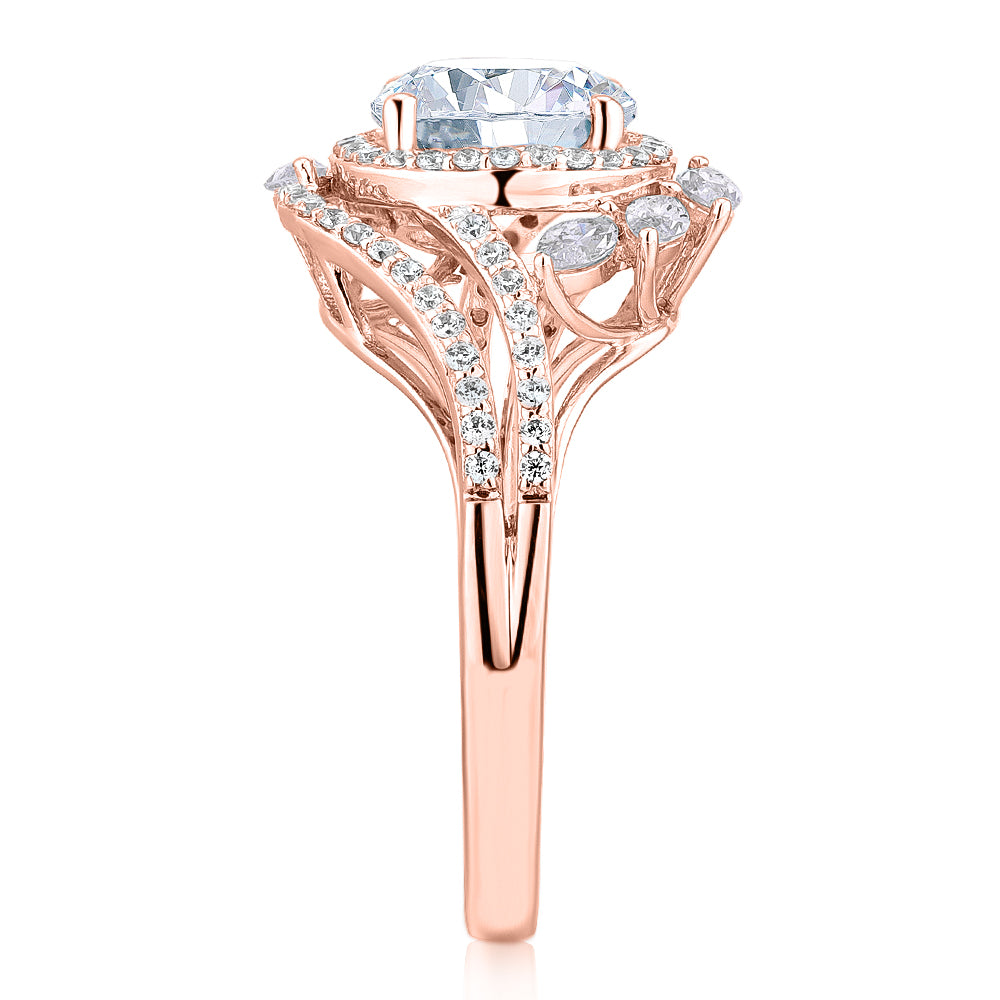 Round Brilliant halo engagement ring with 2.97 carats* of diamond simulants in 14 carat rose gold