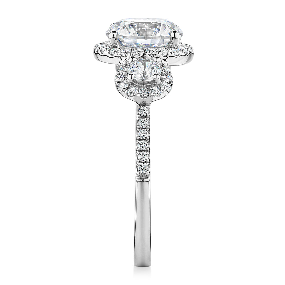 Three stone ring with 2.68 carats* of diamond simulants in 10 carat white gold