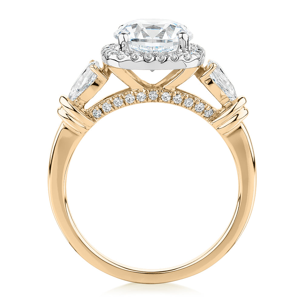 Round Brilliant halo engagement ring with 2.78 carats* of diamond simulants in 14 carat yellow and white gold