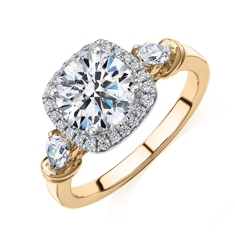 Round Brilliant halo engagement ring with 2.78 carats* of diamond simulants in 14 carat yellow and white gold
