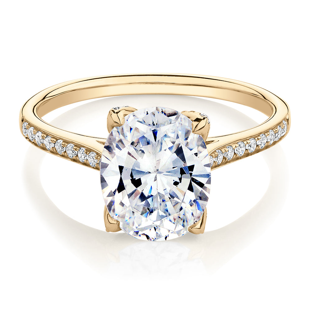 Oval and Round Brilliant shouldered engagement ring with 2.83 carats* of diamond simulants in 14 carat yellow gold