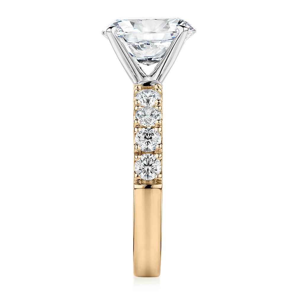 Oval shouldered engagement ring with 3.18 carats* of diamond simulants in 14 carat yellow and white gold