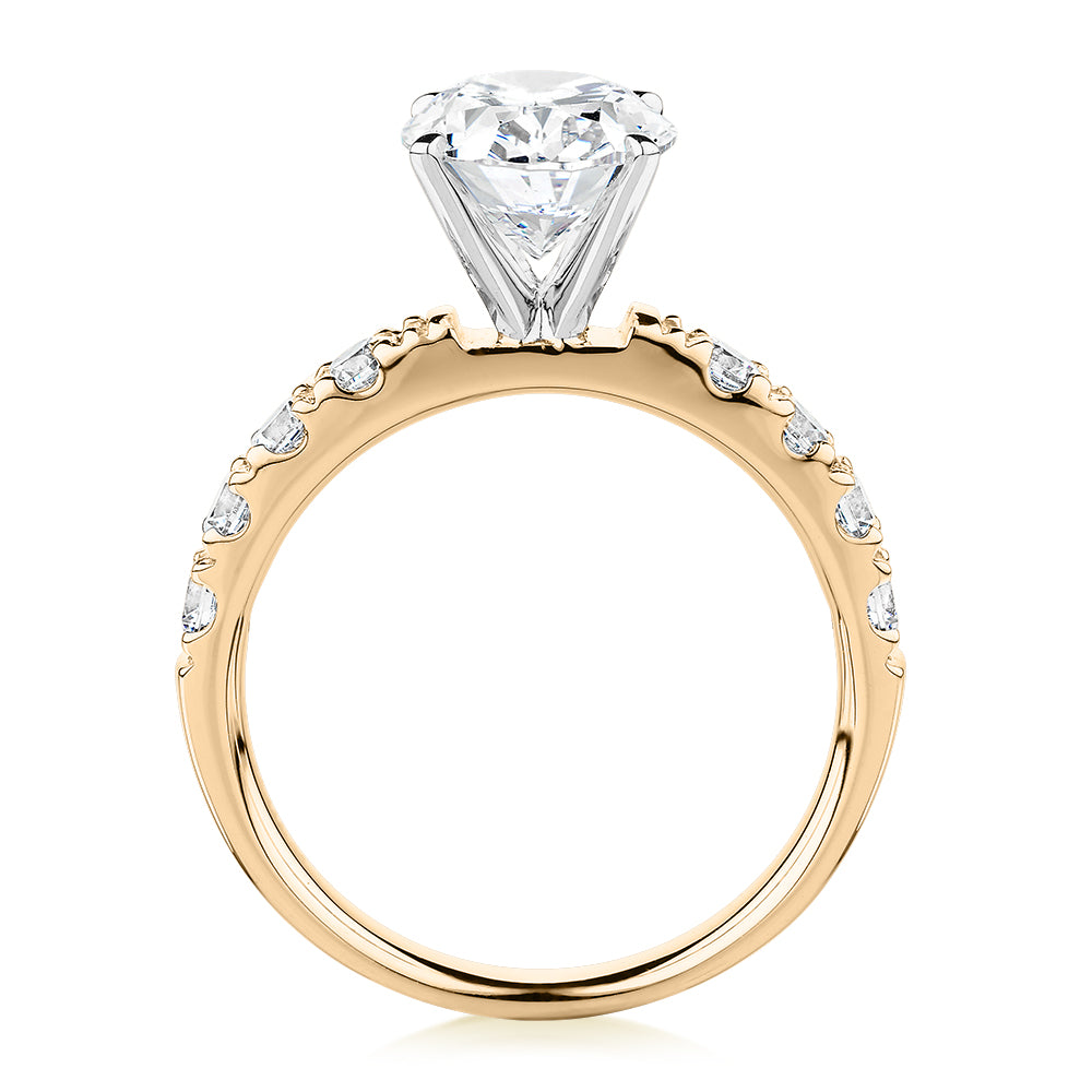 Oval shouldered engagement ring with 3.18 carats* of diamond simulants in 14 carat yellow and white gold