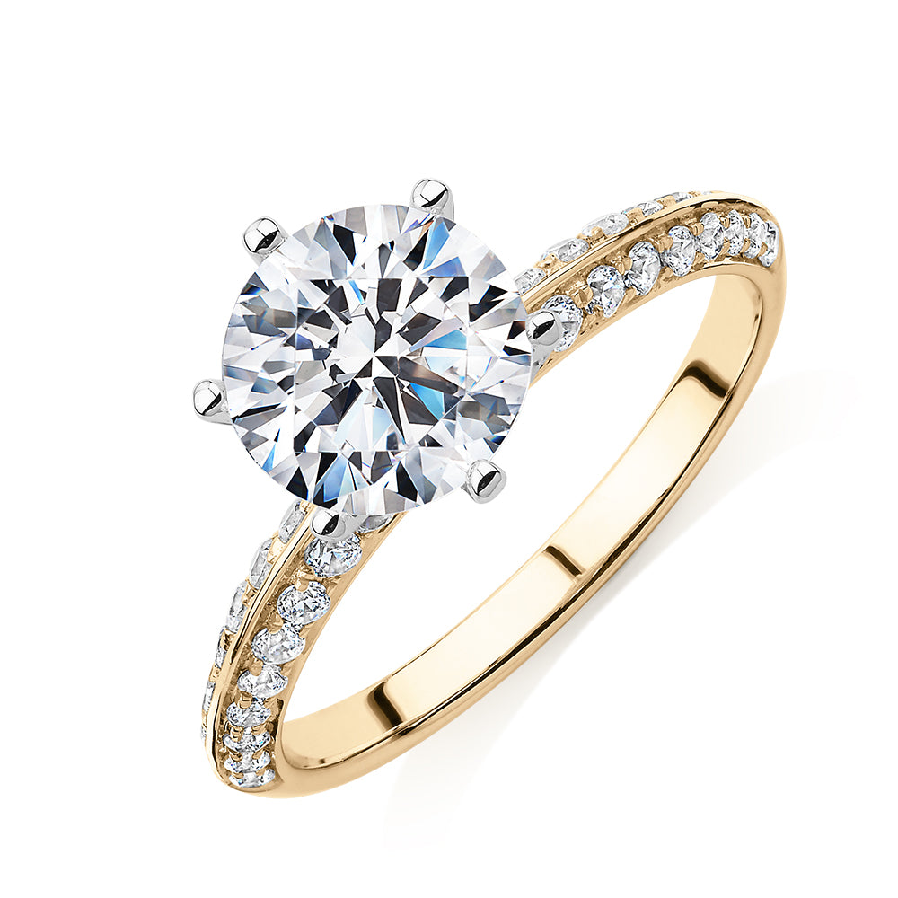 Round Brilliant shouldered engagement ring with 2.47 carats* of diamond simulants in 14 carat yellow and white gold