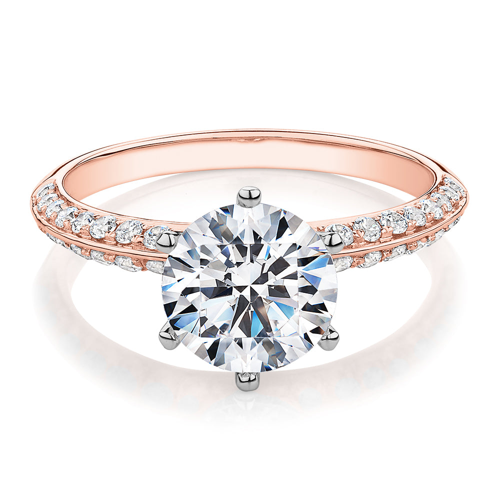 Round Brilliant shouldered engagement ring with 2.47 carats* of diamond simulants in 14 carat rose and white gold