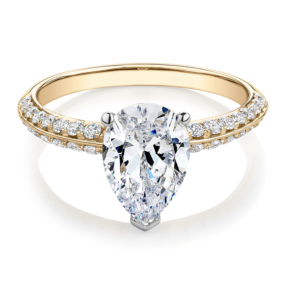 Pear shouldered engagement ring with 2.22 carats* of diamond simulants in 14 carat yellow and white gold
