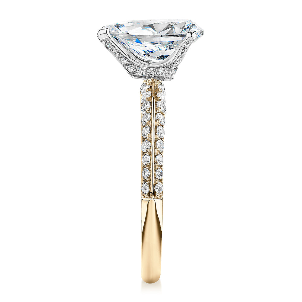 Pear shouldered engagement ring with 2.22 carats* of diamond simulants in 14 carat yellow and white gold
