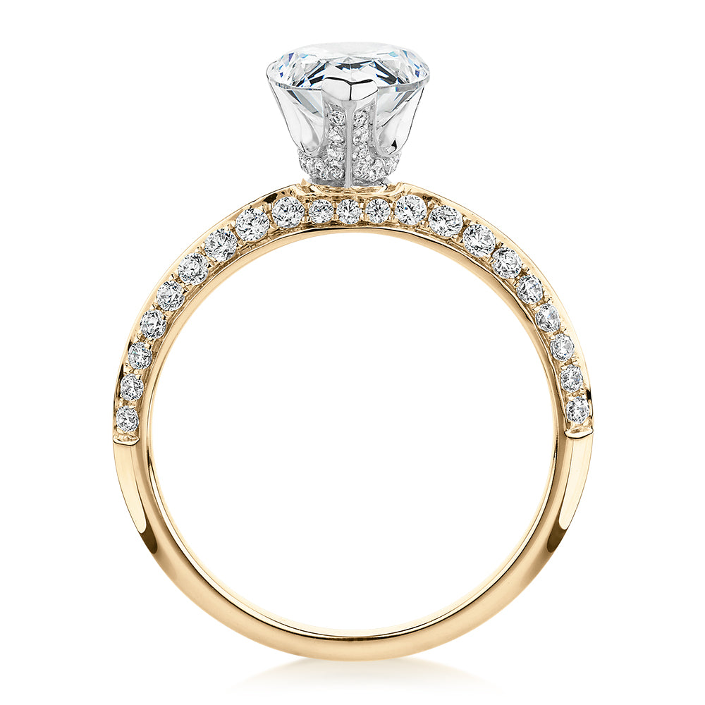 Pear shouldered engagement ring with 2.22 carats* of diamond simulants in 14 carat yellow and white gold
