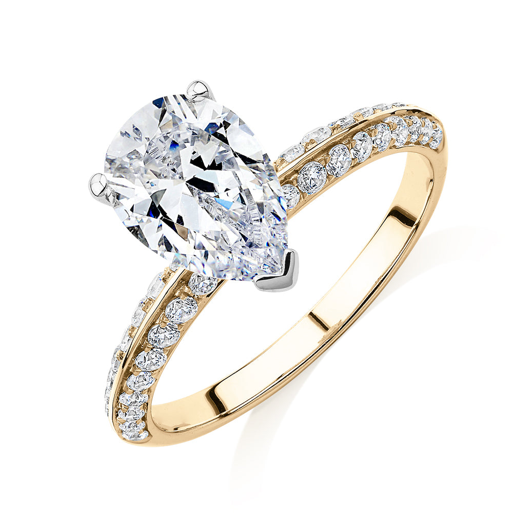 Pear shouldered engagement ring with 2.22 carats* of diamond simulants in 14 carat yellow and white gold
