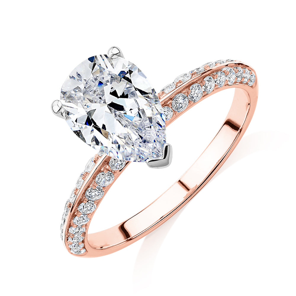 Pear shouldered engagement ring with 2.22 carats* of diamond simulants in 14 carat rose and white gold