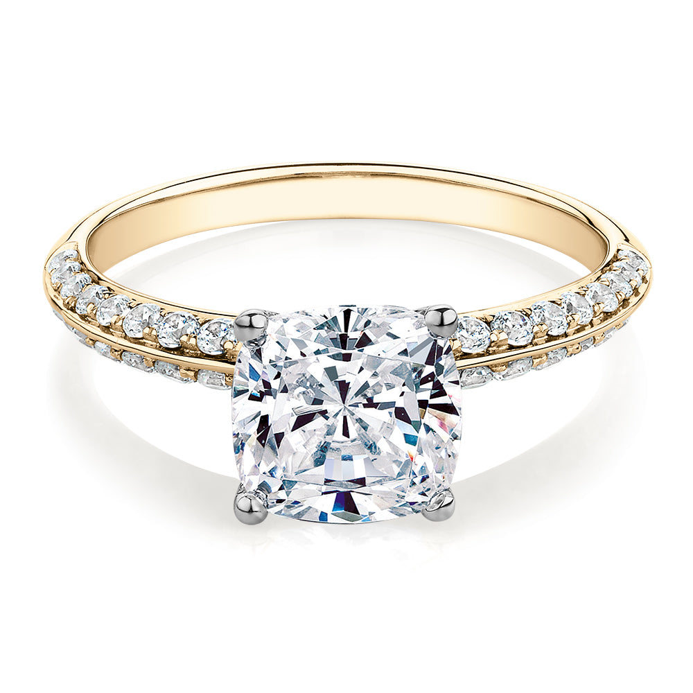 Cushion shouldered engagement ring with 2.08 carats* of diamond simulants in 14 carat yellow and white gold