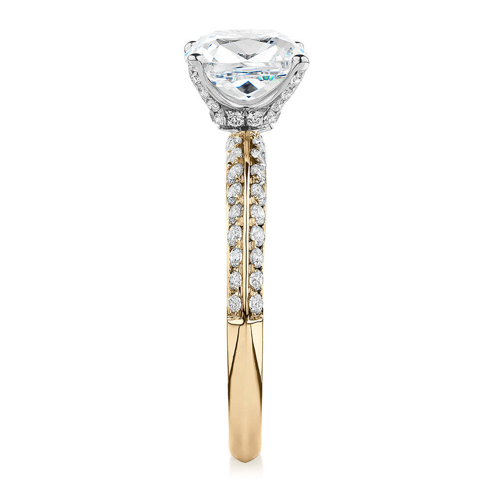 Cushion shouldered engagement ring with 2.08 carats* of diamond simulants in 14 carat yellow and white gold