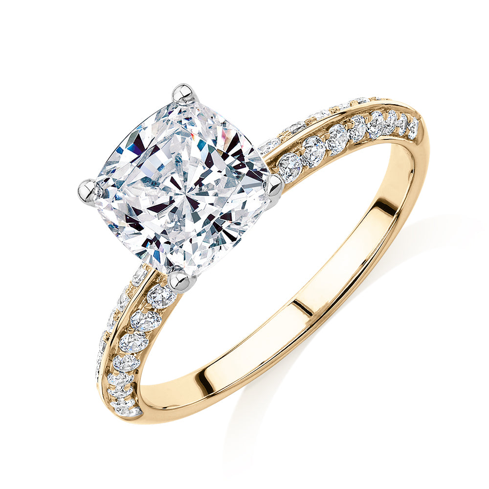 Cushion shouldered engagement ring with 2.08 carats* of diamond simulants in 14 carat yellow and white gold