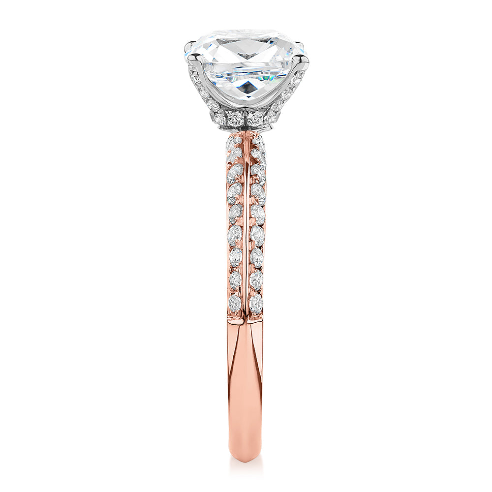 Cushion shouldered engagement ring with 2.08 carats* of diamond simulants in 14 carat rose and white gold