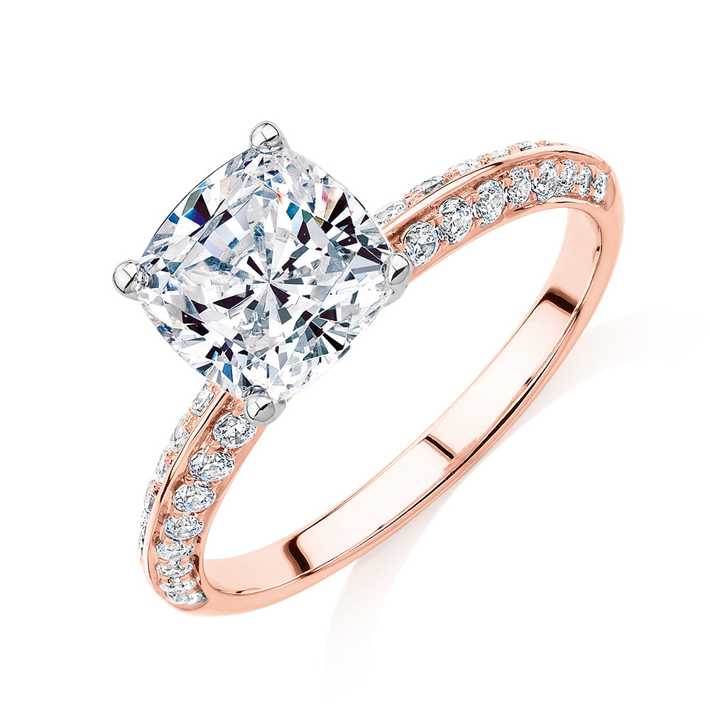 Cushion shouldered engagement ring with 2.08 carats* of diamond simulants in 14 carat rose and white gold