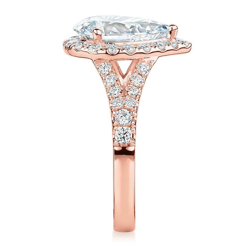 Pear and Round Brilliant halo engagement ring with 3.81 carats* of diamond simulants in 10 carat rose gold