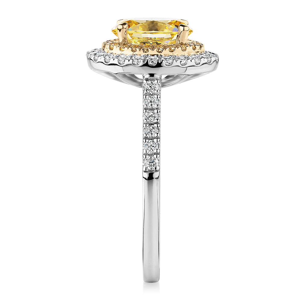 Oval and Round Brilliant halo engagement ring with 1.68 carats* of diamond simulants in 10 carat white and yellow gold