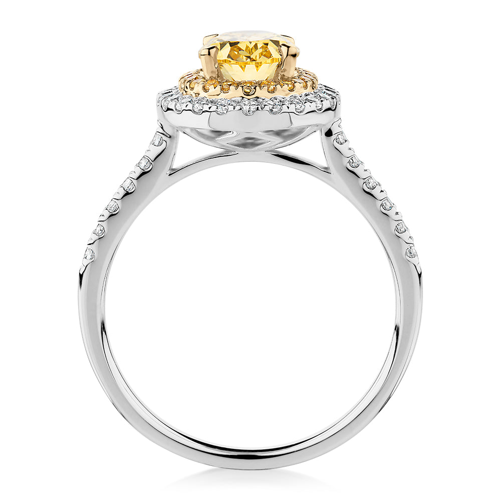 Oval and Round Brilliant halo engagement ring with 1.68 carats* of diamond simulants in 10 carat white and yellow gold