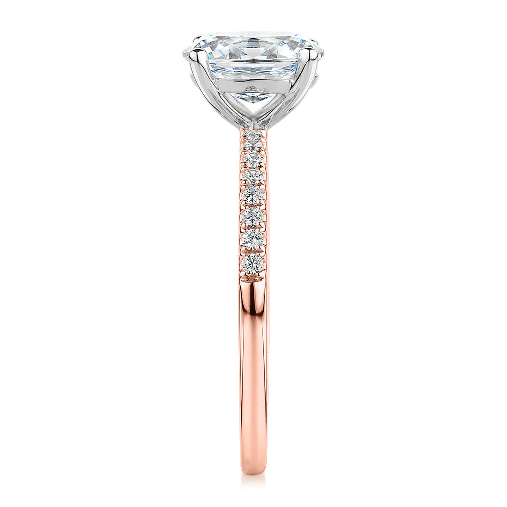 Oval and Round Brilliant shouldered engagement ring with 1.35 carats* of diamond simulants in 14 carat rose and white gold