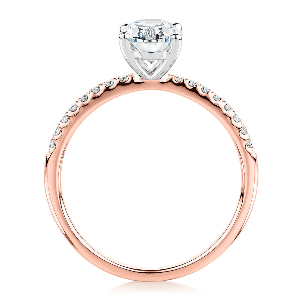 Oval and Round Brilliant shouldered engagement ring with 1.35 carats* of diamond simulants in 14 carat rose and white gold